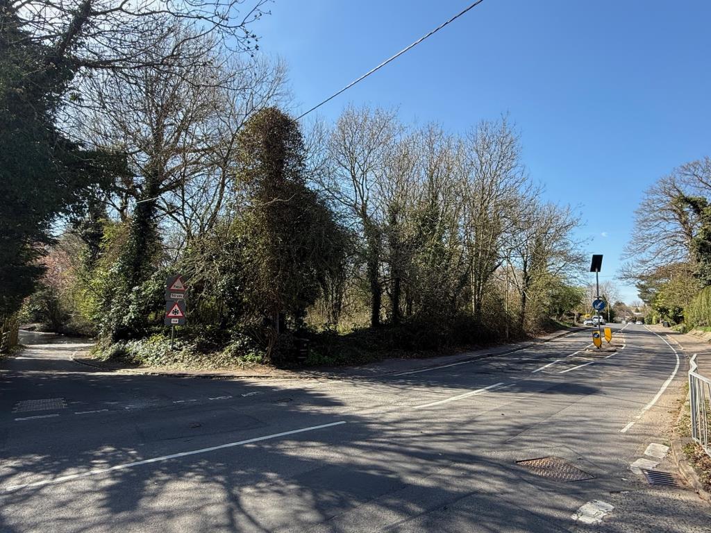 Lot: 63 - LAND WITH POTENTIAL - View of the land from the corner of Mill Lane